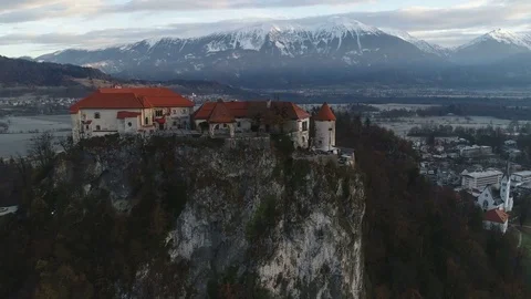 Drone shot beautiful Bled castle, snowy mountain landscape Slovenia Europe Video stock 85454616
