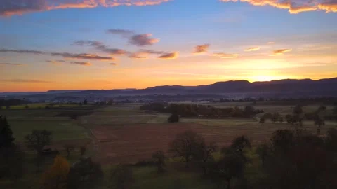 Drone shot of a beautiful dramatic sunrise over Dusslingen in autumn Stock Footage 143431140