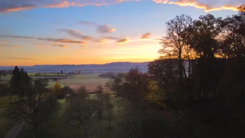 Drone shot of a beautiful dramatic sunrise over Dusslingen in autumn Stock Footage 143431762