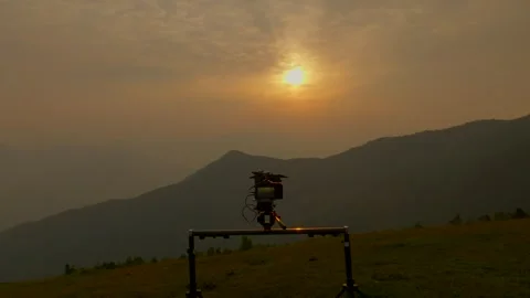 Drone shot from behind the camera when shooting sunrise for documentary Video stock 277130735