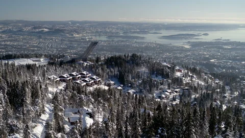 Drone shot behind Holmenkollen, view over Oslo, Norway, back Stock Footage 86549416