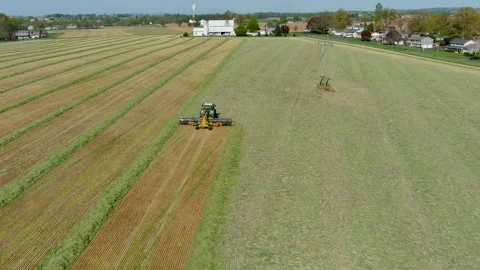 Drone Shot Behind Tractor on Farm 4K Vídeo Stock 239351086