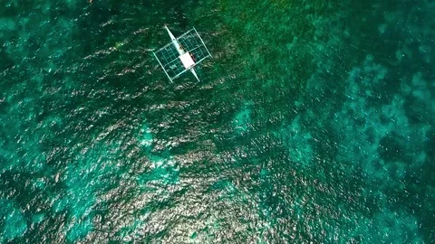 A drone shot of a big rock in te ocean in Philippines Stock Footage 109817210