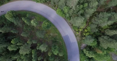 Drone shot of a biker driving up Grefsenkollen in Oslo, Norway, wideshot Stock Footage 71297250