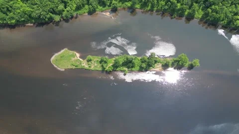 Drone Shot of Blue River with Trees Along Shoreline with Green Forest Landscape Stock Footage 244958614