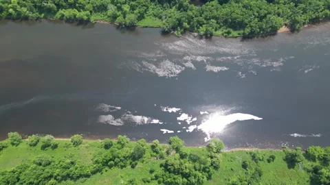 Drone Shot of Blue River with Trees Along Shoreline with Green Forest Landscape Stock Footage 244958726