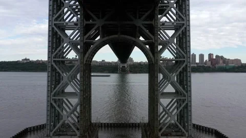 Drone Shot of Boat Going Under Bridge on the Manhattan Bridge (4K) Stock Footage 145384545