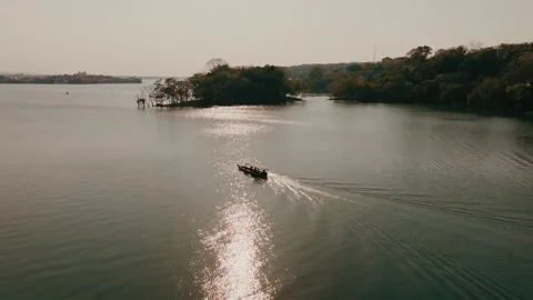Drone Shot of Boat at Sunset Over Lago Petén Itzá, Flores Island, Guatemala – Stock Footage 340036468
