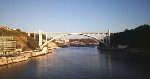 Drone shot of bridge across the river overlooking cityscape of Porto, Portugal Stock Footage 114854798