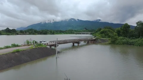 Drone Shot of Bridge and Mountain Landscape in Laos Stock Footage 345410812