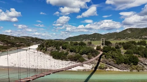 Drone Shot of Bridge Over Mountain River in Scenic Area Stock Footage 332059643