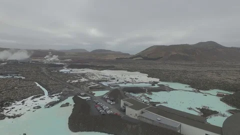 Drone shot: Bright colored Blue lagoon geothermal spa full of people, Iceland Stock Footage 93390831
