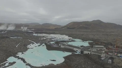 Drone shot: Bright colored Blue lagoon geothermal spa full of people, Iceland Stock Footage 93390890