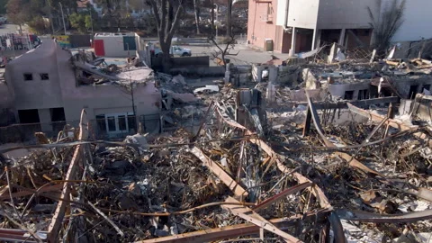 Drone shot of building completely damaged in Pacific Palisades Fire Stock Footage 300577609