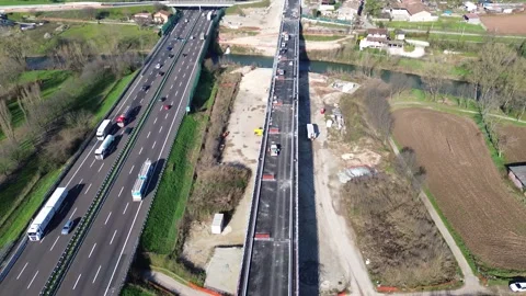 Drone Shot of Busy Highway Section with High-Speed Rail Construction Site – Stock Footage 307608153