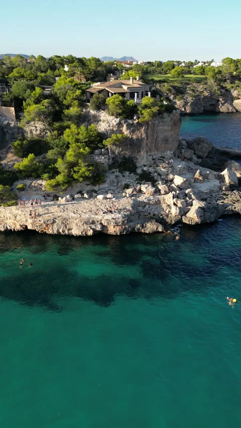 Drone shot in Cala Llombards at sunset, Mallorca, Spain Stock Footage 254630669