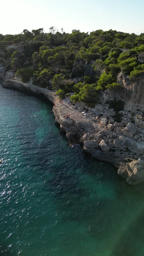 Drone shot in Cala Llombards at sunset, Mallorca, Spain Stock Footage 254631096