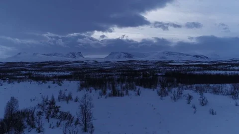 Drone shot, camera up of a snow field in Abisko, Sweden Stock Footage