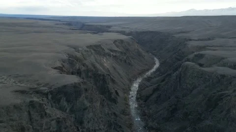 Drone shot of a canyon with a river Stock Footage 227127511