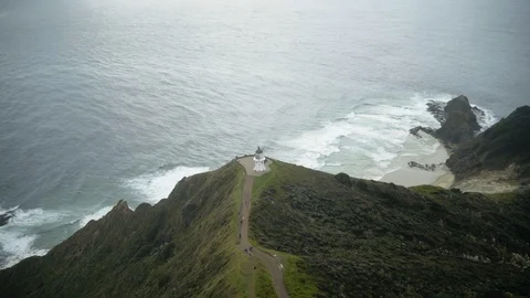Drone shot of Cape Reinga Lighthouse in New Zealand Stock Footage 86498379