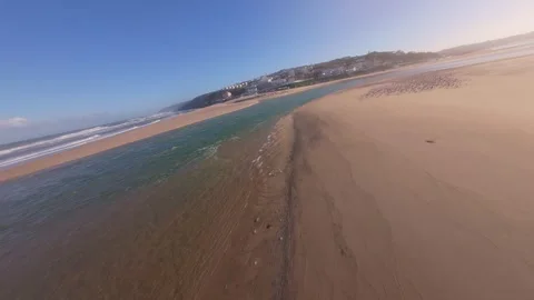 Drone shot captures beach shoreline during daylight Stock Footage 344582495