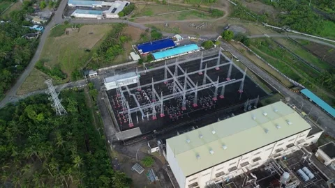 Drone shot captures geothermal site, large steel structure dominates. Stock Footage 336796136