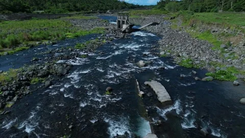 Drone shot captures swift river with frothy water. Ideal for nature document Stock Footage 336854896