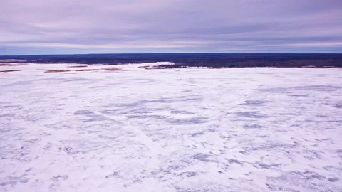 Drone shot capturing abstract frozen ice textures on the Great Lakes surface Stock Footage 336012438