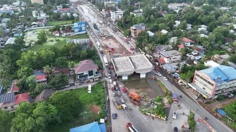 Drone shot capturing the Alappuzha Bypass with an under-construction overpass Stockbeeldmateriaal 341110378