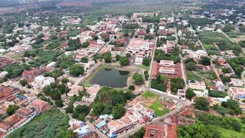 Drone shot capturing Chettinad Palace under bright afternoon light. Elegant Stock Footage 339378746