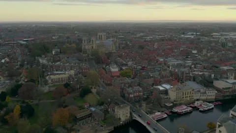 Drone shot capturing the cityscape of York with historic buildings and River Stock Footage 296760659