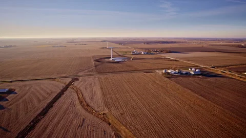 Drone shot capturing windmill construction in rural American farmland Stock Footage 328388207