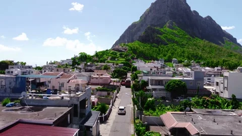 Drone shot of car approaching mountain Stock Footage 237628343