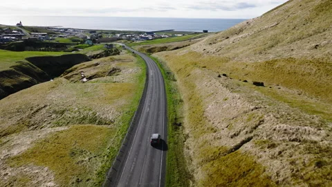 Drone Shot Of A Car Driving On An Empty Road Stock Footage 234135102