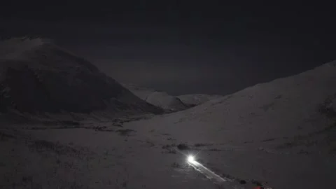 Drone Shot of Car Driving through Valley in Norway - 30fps Видео 338401505