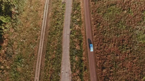Drone shot of a car moving the old village road 4K 스톡 동영상 163319612