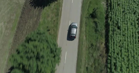 Drone shot of a car on the road Video stock 150803659