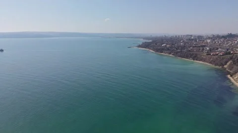 Drone shot cargo vessel moving slowly across calm sea Видео 331235420