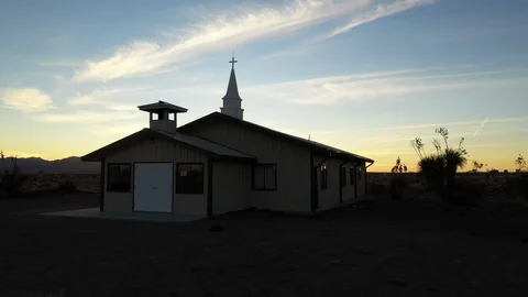 Drone shot of a churc with sunset behind in El Paso, Texas Stock Footage 128657413