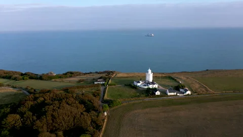 Drone shot circling around a lighthouse with the ocean in the background. 4k Stock Footage 147367328