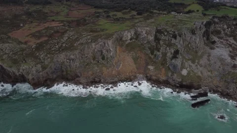 A drone shot of a cliff from the sea 動画素材 150361848