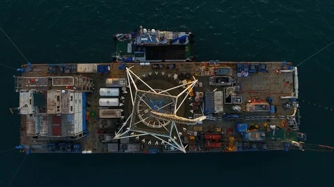 Drone shot close to the structure of an oil rig submarine cable station Stock Footage 100072452