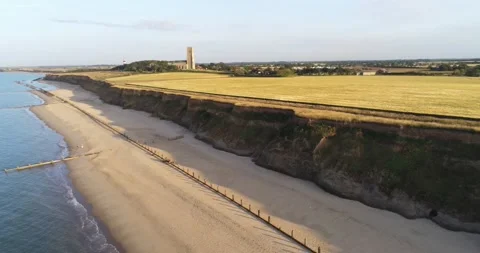 Drone shot of Coast, Cliffs and Church - Happisburgh, Norfolk Stock Footage 205330946