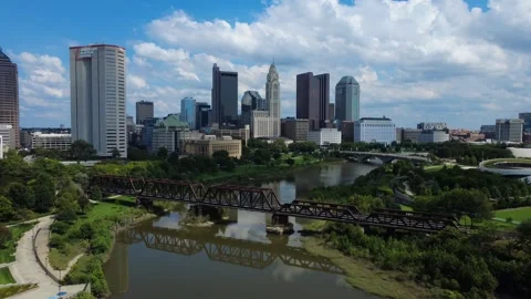 Drone shot of the Columbus, Ohio skyline on a sunny day capturing the LeVeque Video stock 345133530