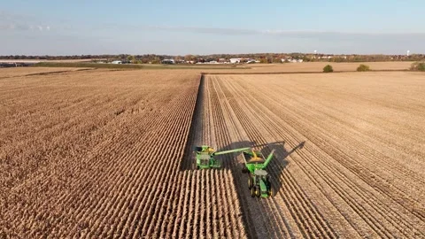 Drone shot combine with tractor Stock Footage 244139073