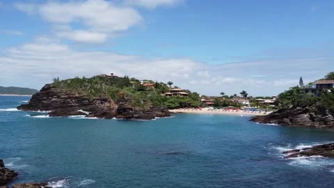 A drone shot coming into the beach with waves Stock Footage 169096630