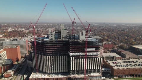 Drone shot of construction of new tall hospital Stock Footage 220581517