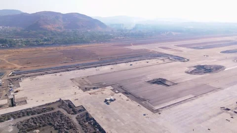 Drone shot Construction vehicles prepare ground for runway Stock Footage 308056630