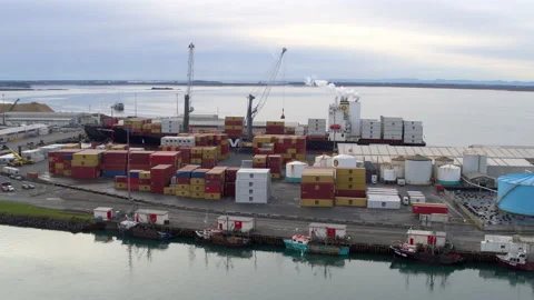 Drone shot of container ship and cranes at dock Stock Footage 155378253