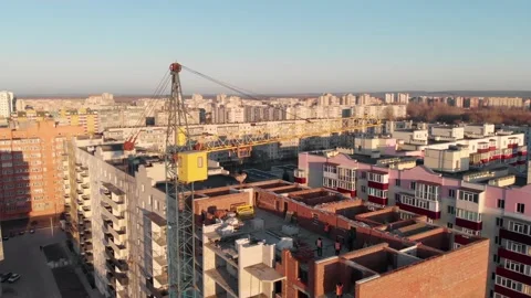 Drone shot of a crane boom or boom at a construction site Video stock 145688378